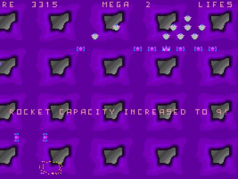 A later level
<br>The aliens ate different, but still numerous, and the player has just picked up a bonus item - extra missile capability
