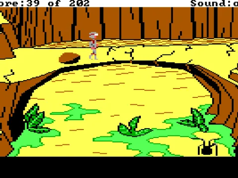 Rock bridge... A deadly spider droid is below.  (EGA/Tandy)