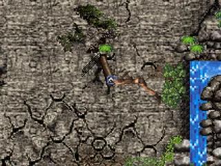 Lara acrobatically swings across the cliff.