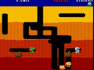 Dig Dug - Trying to crush an enemy with a rock.