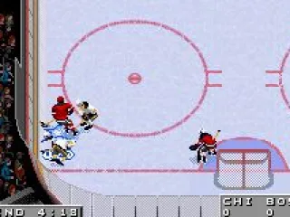 The Hawks and Bruins wrestle for control in the corner.