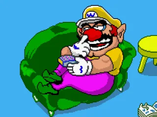 Wario lying on his couch and pickin' at it.
