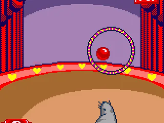 Get the ball through the hoop in Circus Toss.