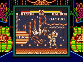 Bison's Scissors Kick striking the challenger.