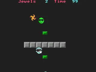 Bounce into the green jewels to collect them while being careful not to hit into the enemies.