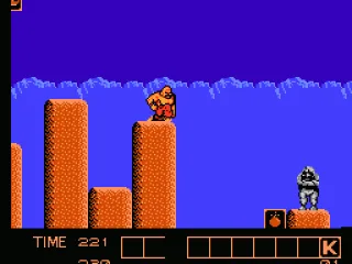 Crouching on pillar; rock chucker in view